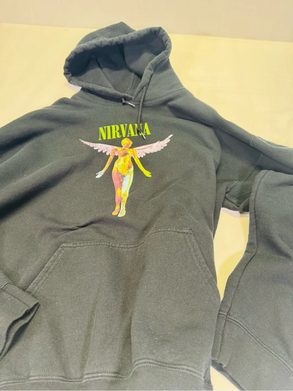 NIRVANA Black Crewneck Hoodie with Yellow-Green Logo and Multicolor Angel